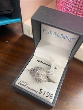 Ring sterling Silver-Tone Pave Halo Ring
2 pieces 
1/4 cttw
Genuine diamond